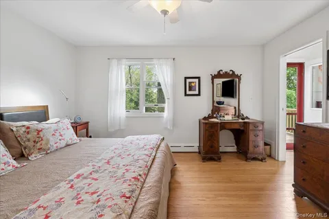 a bedroom with a bed and a tv