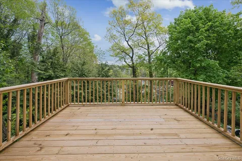 a balcony with trees in front of it