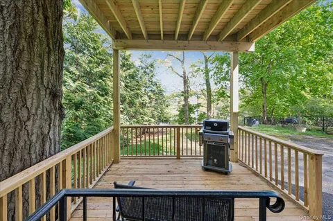 a view of a balcony with wooden floor