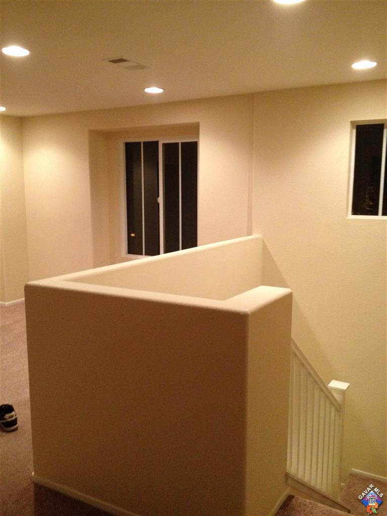 38217 Rioja Court Palmdale, CA 93550 - Photo 6 of 14 a view of an empty room with wooden floor