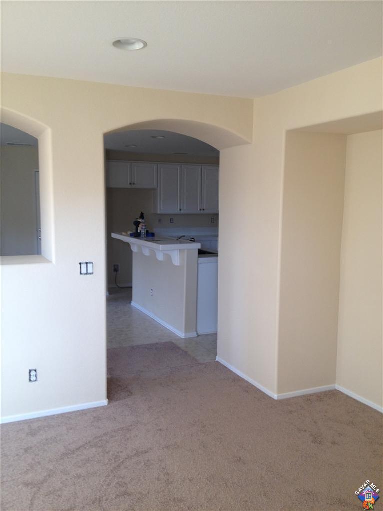 38217 Rioja Court Palmdale, CA 93550 - Photo 9 of 14 a kitchen with cabinets and a stove top oven