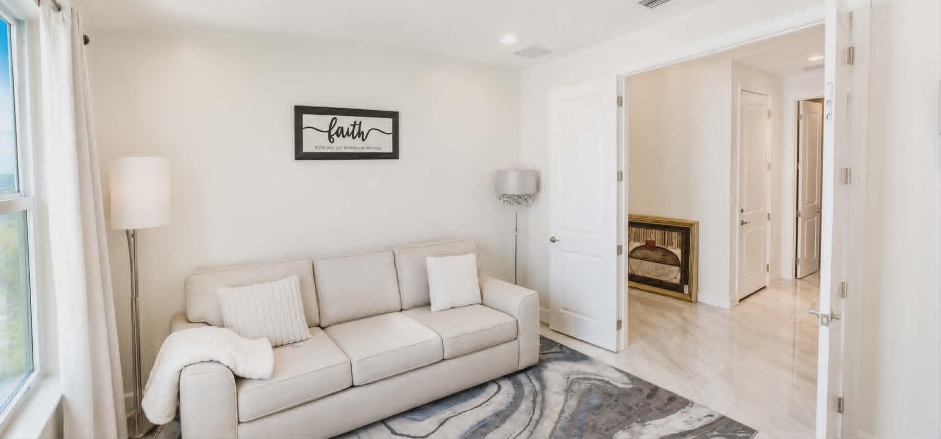 19179 Rolling Acrs Road Loxahatchee, FL 33470 - Photo 6 of 38 a living room with furniture and a gate
