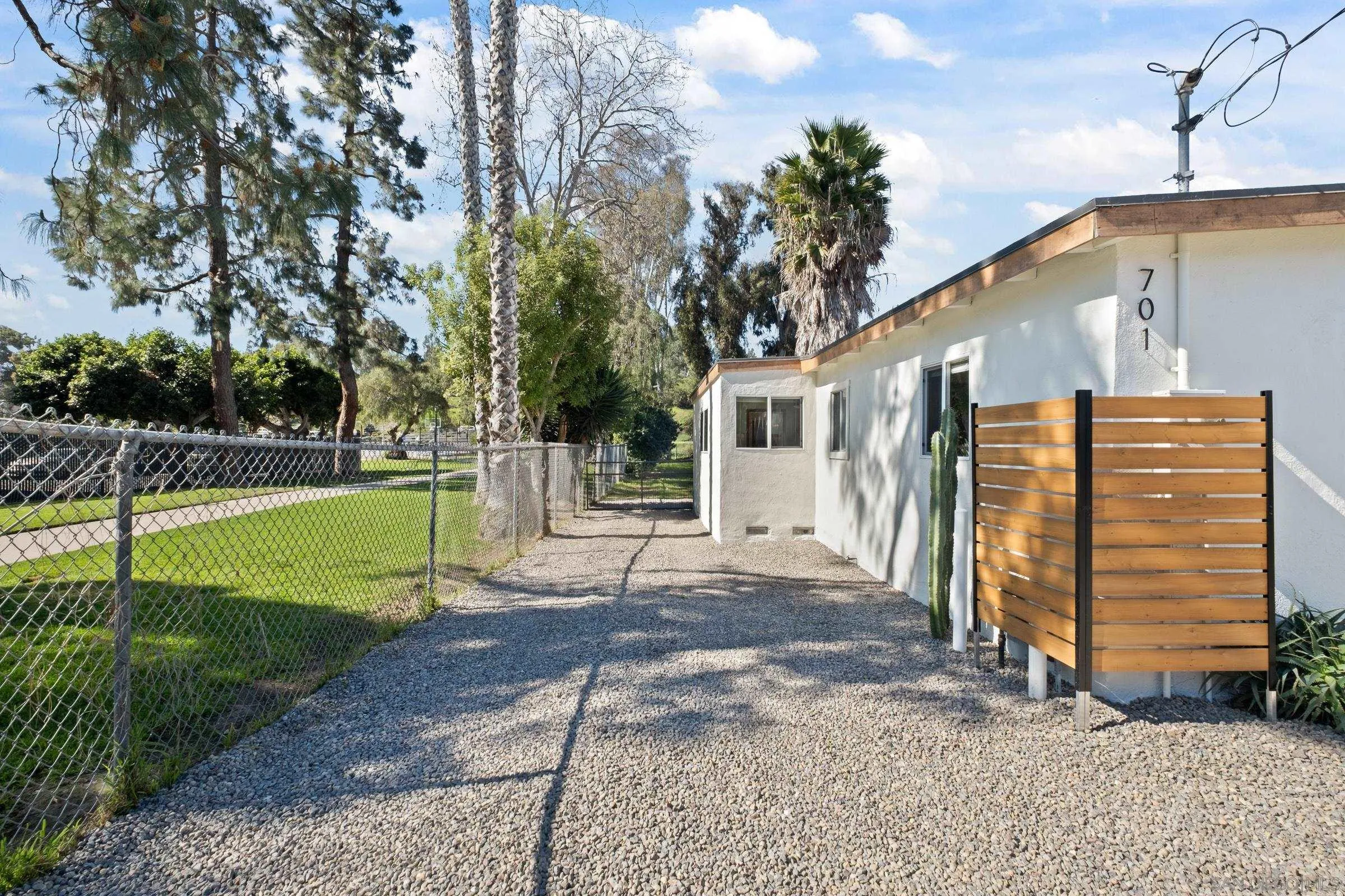 701 Valley Avenue Solana Beach, CA 92075 - Photo 11 of 38 a view of a house with backyard and a tree