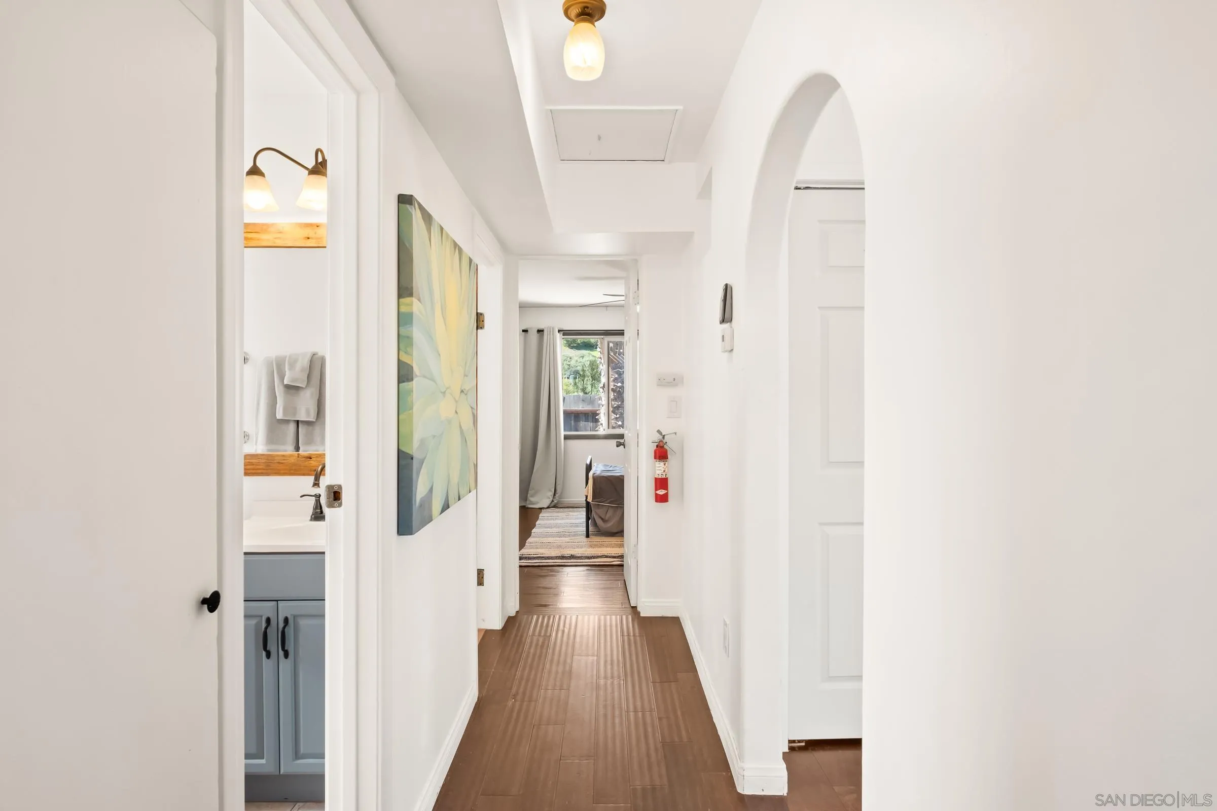 701 Valley Avenue Solana Beach, CA 92075 - Photo 27 of 38 a view of a hallway with wooden floor and entryway