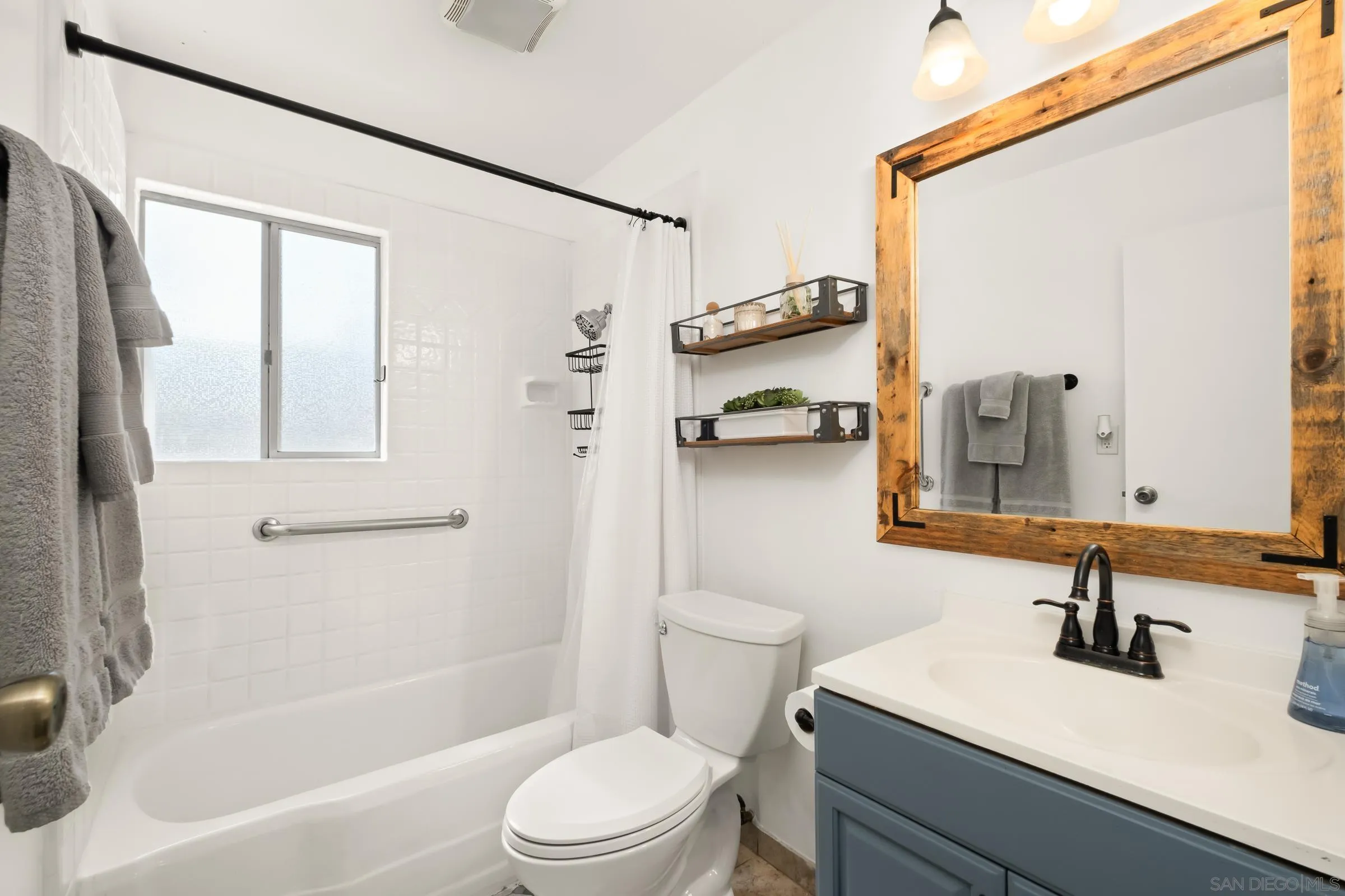 701 Valley Avenue Solana Beach, CA 92075 - Photo 28 of 38 a bathroom with a sink a toilet and shower
