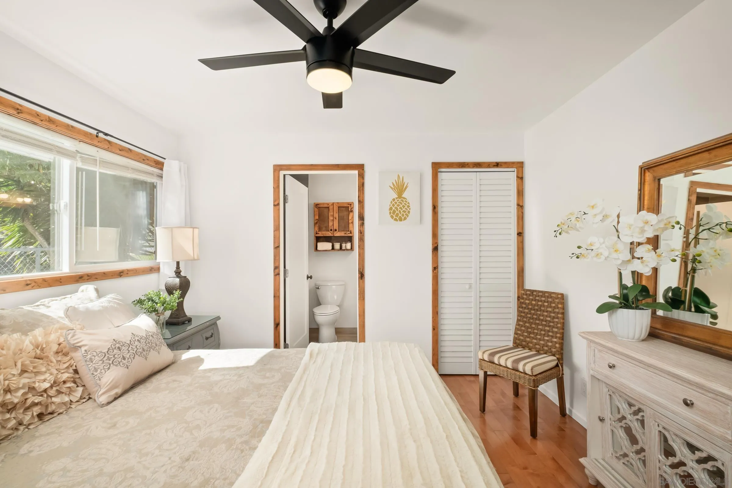 701 Valley Avenue Solana Beach, CA 92075 - Photo 30 of 38 a bedroom with a bed dresser and a large window