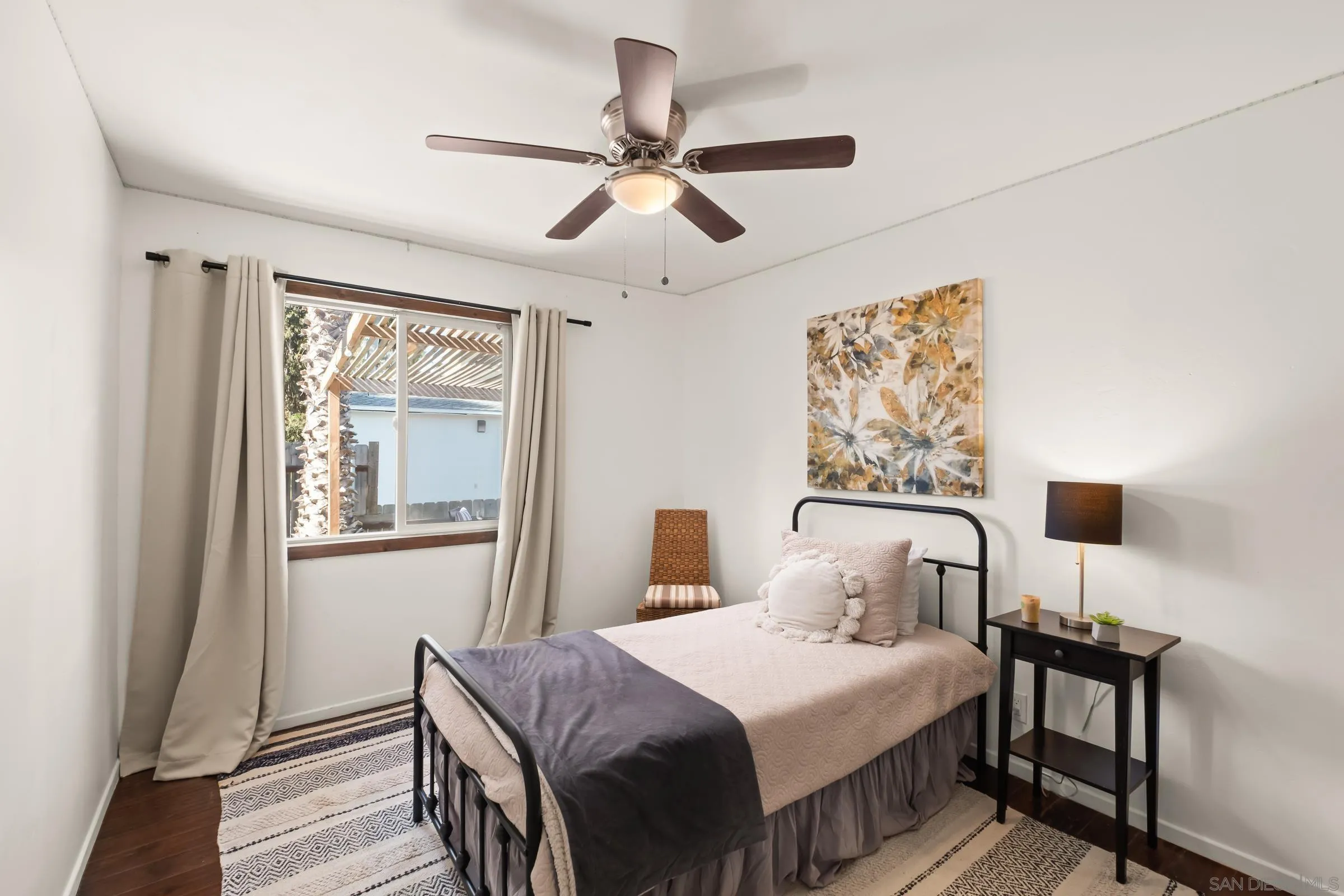 701 Valley Avenue Solana Beach, CA 92075 - Photo 34 of 38 a bedroom with a bed and wooden floor