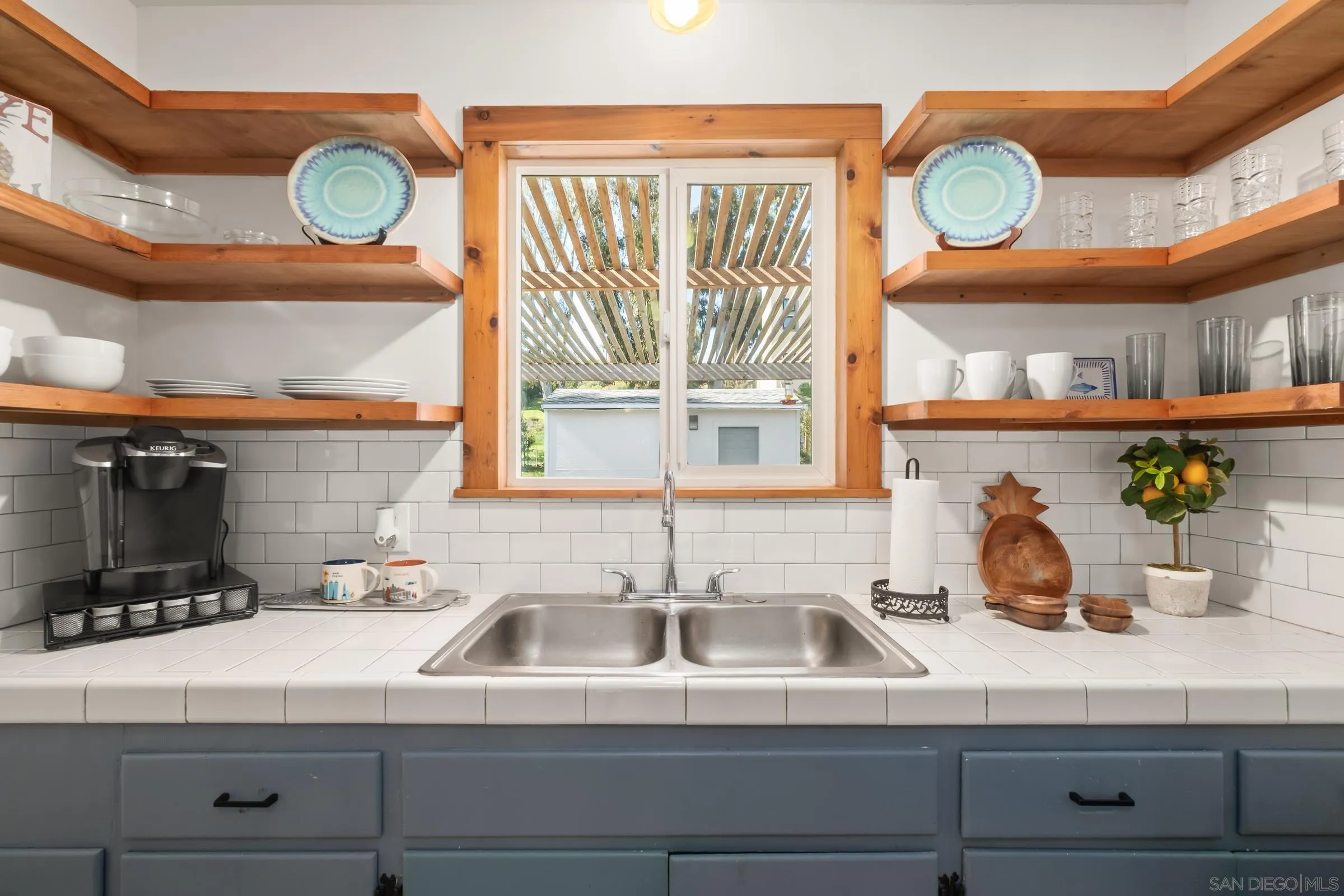 701 Valley Avenue Solana Beach, CA 92075 - Photo 37 of 38 a kitchen sink with a stove and a window
