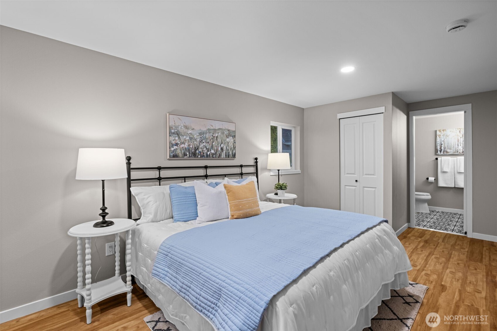 211 Taylor Street Snohomish, WA 98290 - Photo 11 of 24 a bedroom with a bed and a lamp