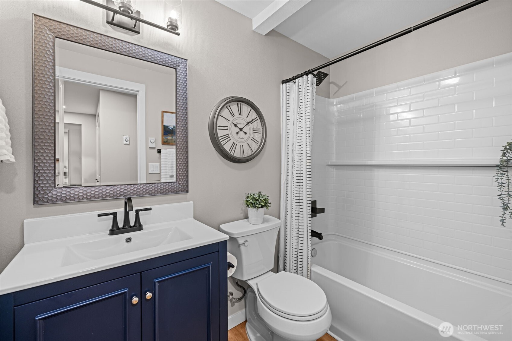 211 Taylor Street Snohomish, WA 98290 - Photo 16 of 24 a bathroom with a toilet a sink and a mirror