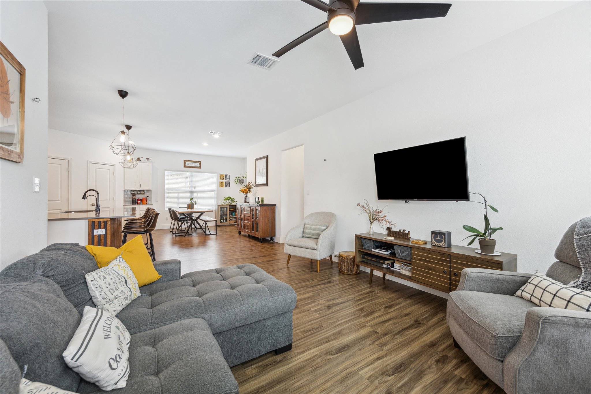 700 Legends Lane Georgetown, TX 78628 - Photo 13 of 31 Living room featuring dark wood-style flooring and a ceiling fan