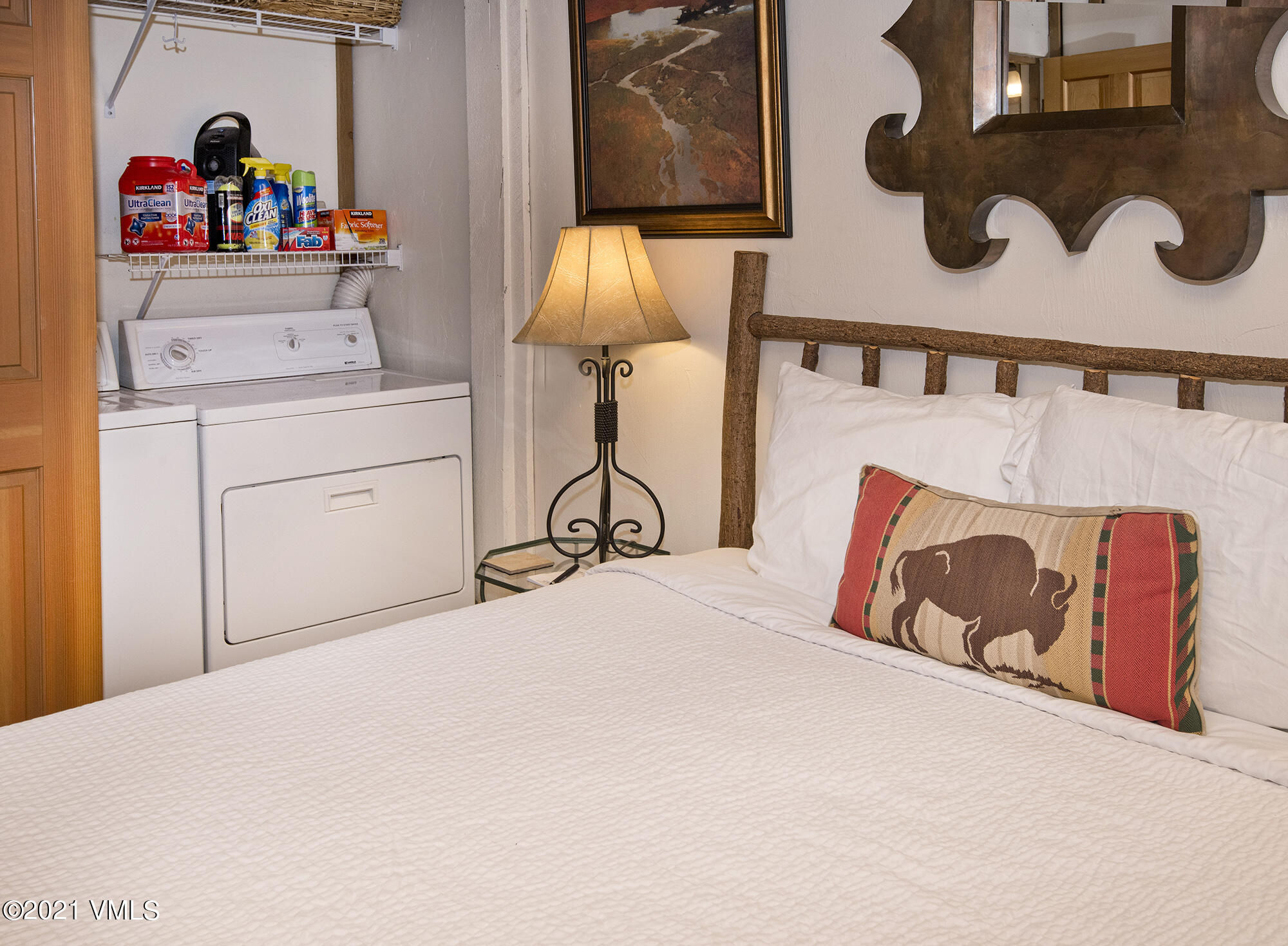 2958 South Frontage Road West, Unit D3 Vail, CO 81657 - Photo 11 of 23 a bedroom with a bed and dresser