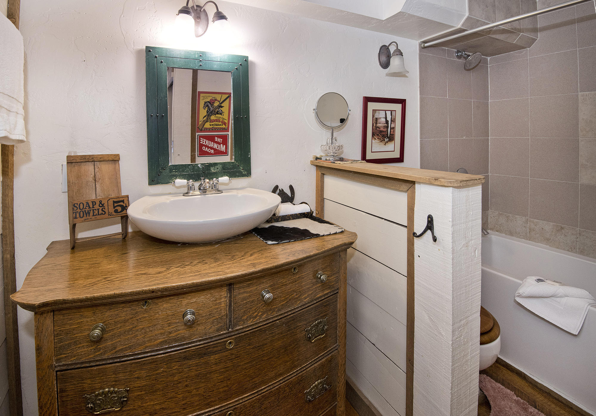 2958 South Frontage Road West, Unit D3 Vail, CO 81657 - Photo 13 of 23 a bathroom with a sink a toilet and shower