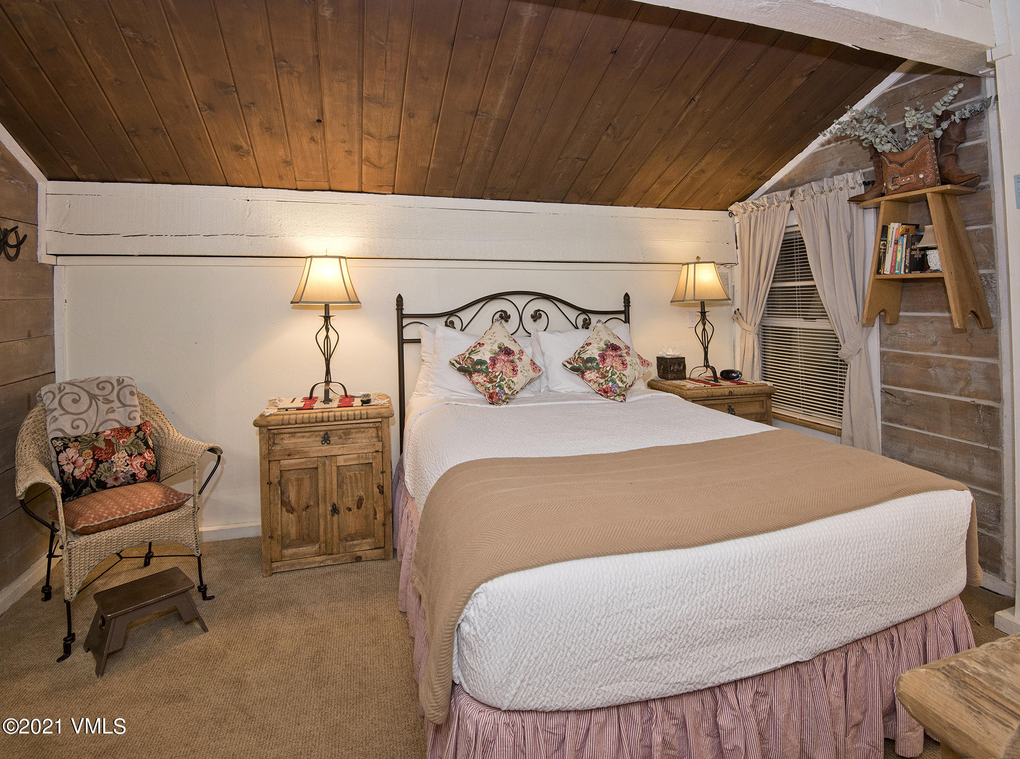 2958 South Frontage Road West, Unit D3 Vail, CO 81657 - Photo 16 of 23 a bed sitting in a bedroom next to a window