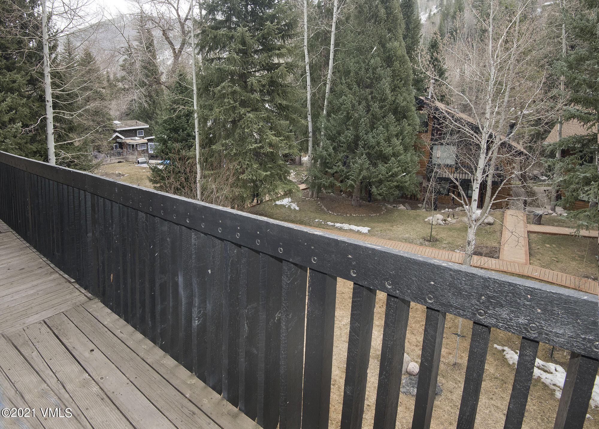 2958 South Frontage Road West, Unit D3 Vail, CO 81657 - Photo 18 of 23 a wooden bench sitting in front of a building