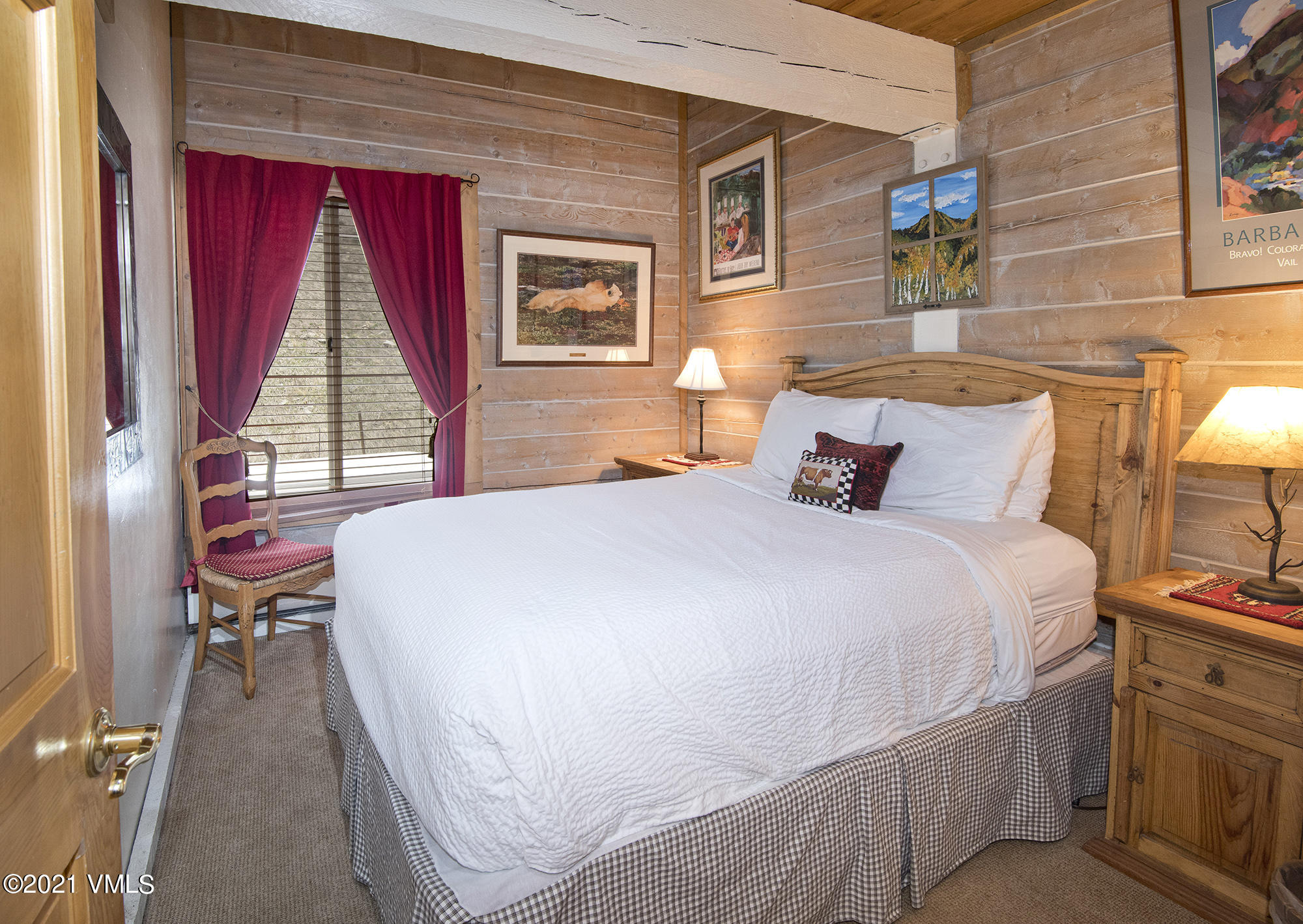 2958 South Frontage Road West, Unit D3 Vail, CO 81657 - Photo 9 of 23 a bedroom with a bed and wooden floor