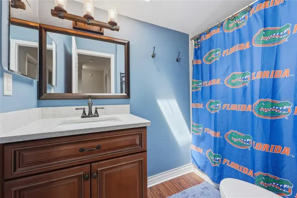 a bathroom with a sink a vanity and a mirror