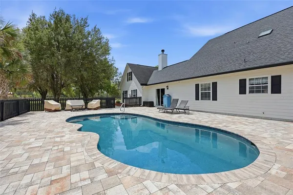 a view of a house with swimming pool