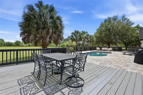 a patio with wooden floor and city view