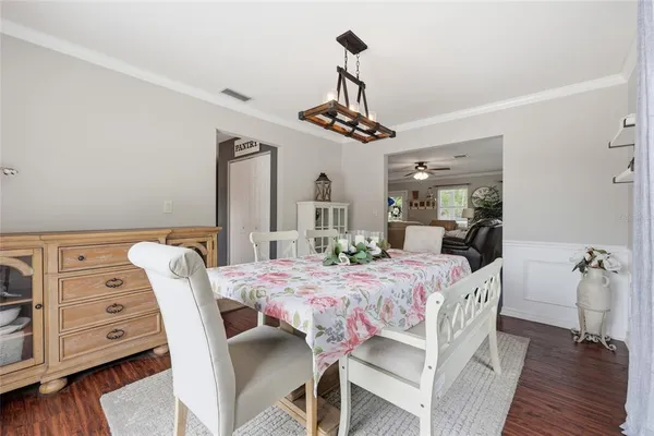 a dining room with furniture and window