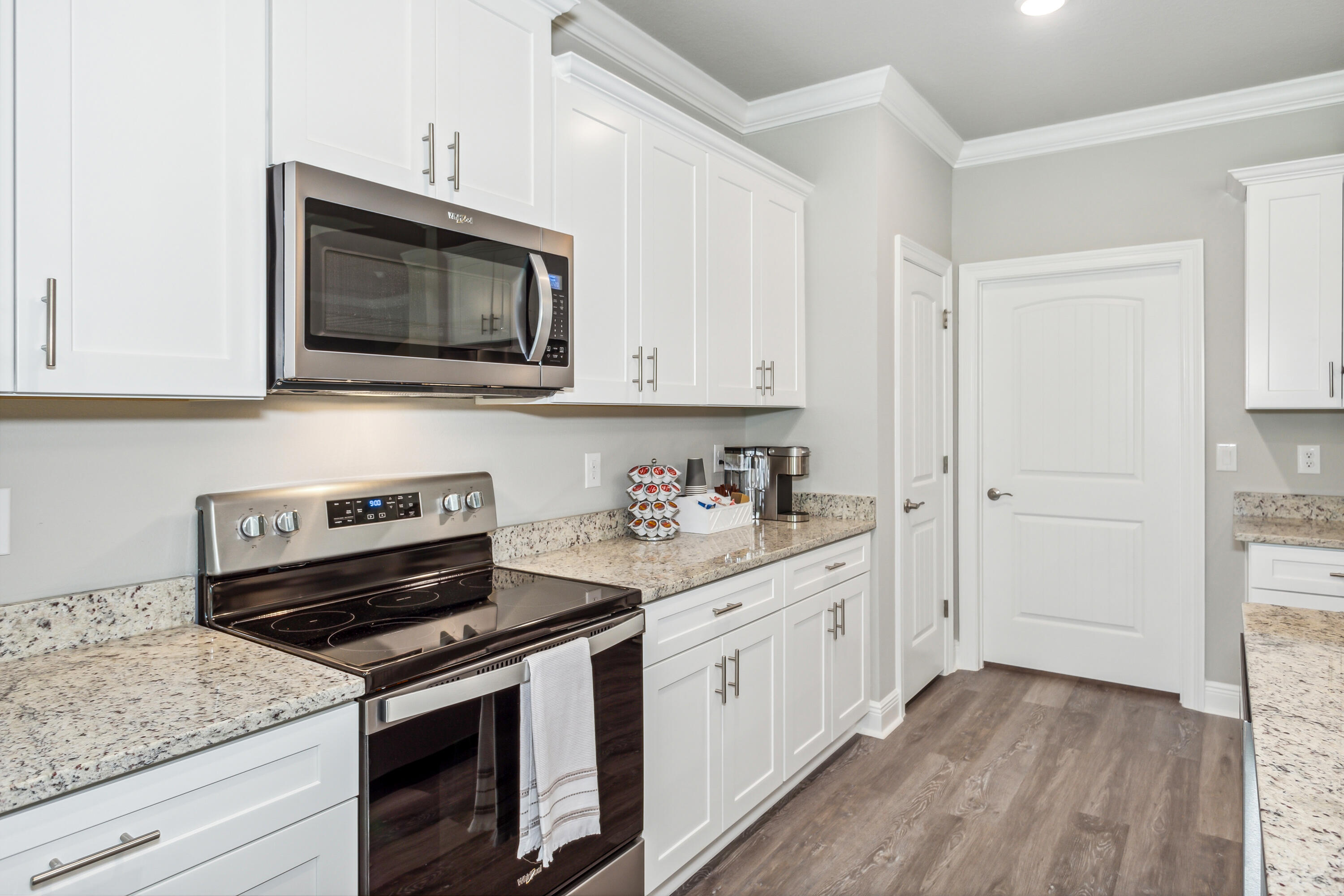 8721 Valhalla Drive Milton, FL 32583 - Photo 17 of 48 a kitchen with a stove and a microwave