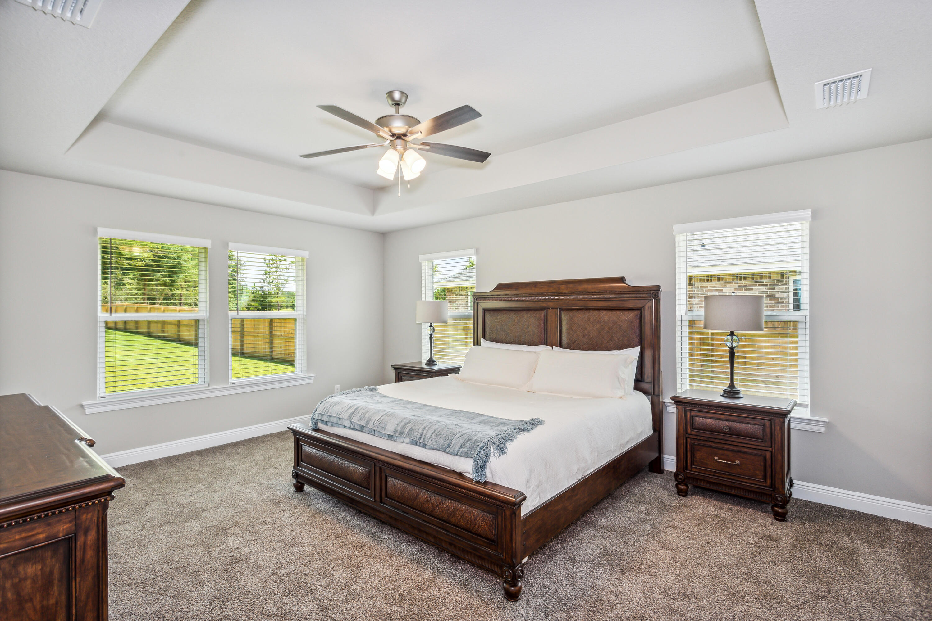 8721 Valhalla Drive Milton, FL 32583 - Photo 20 of 48 a spacious bedroom with a bed and a window