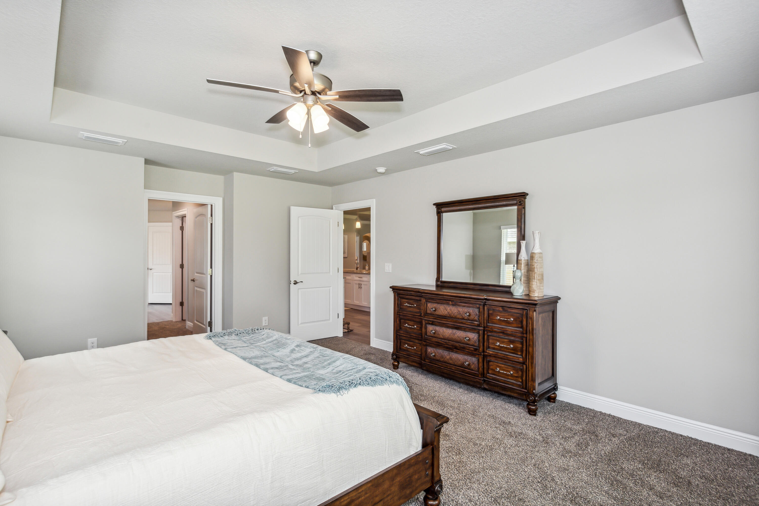 8721 Valhalla Drive Milton, FL 32583 - Photo 21 of 48 a bedroom with a bed and a dresser