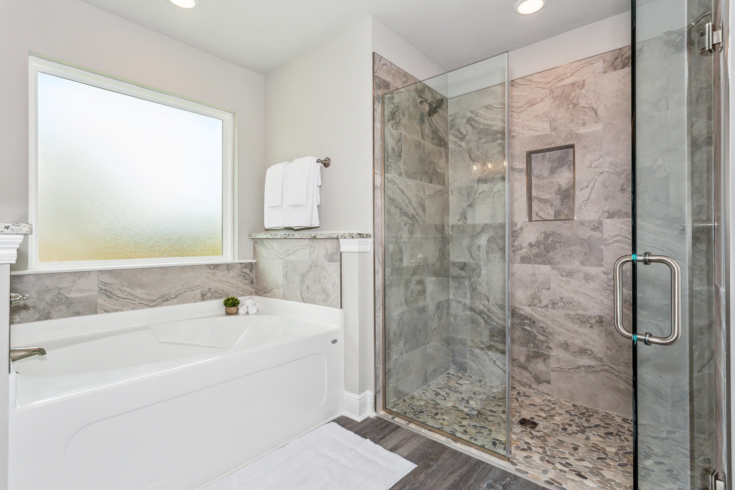 8721 Valhalla Drive Milton, FL 32583 - Photo 23 of 48 a bathroom with a bathtub and a shower