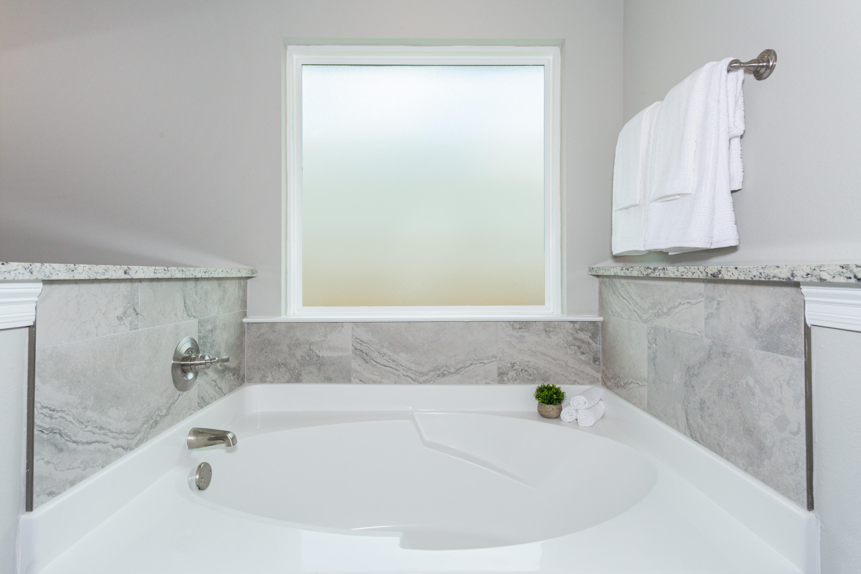 8721 Valhalla Drive Milton, FL 32583 - Photo 27 of 48 a white bath tub sitting next to a shower