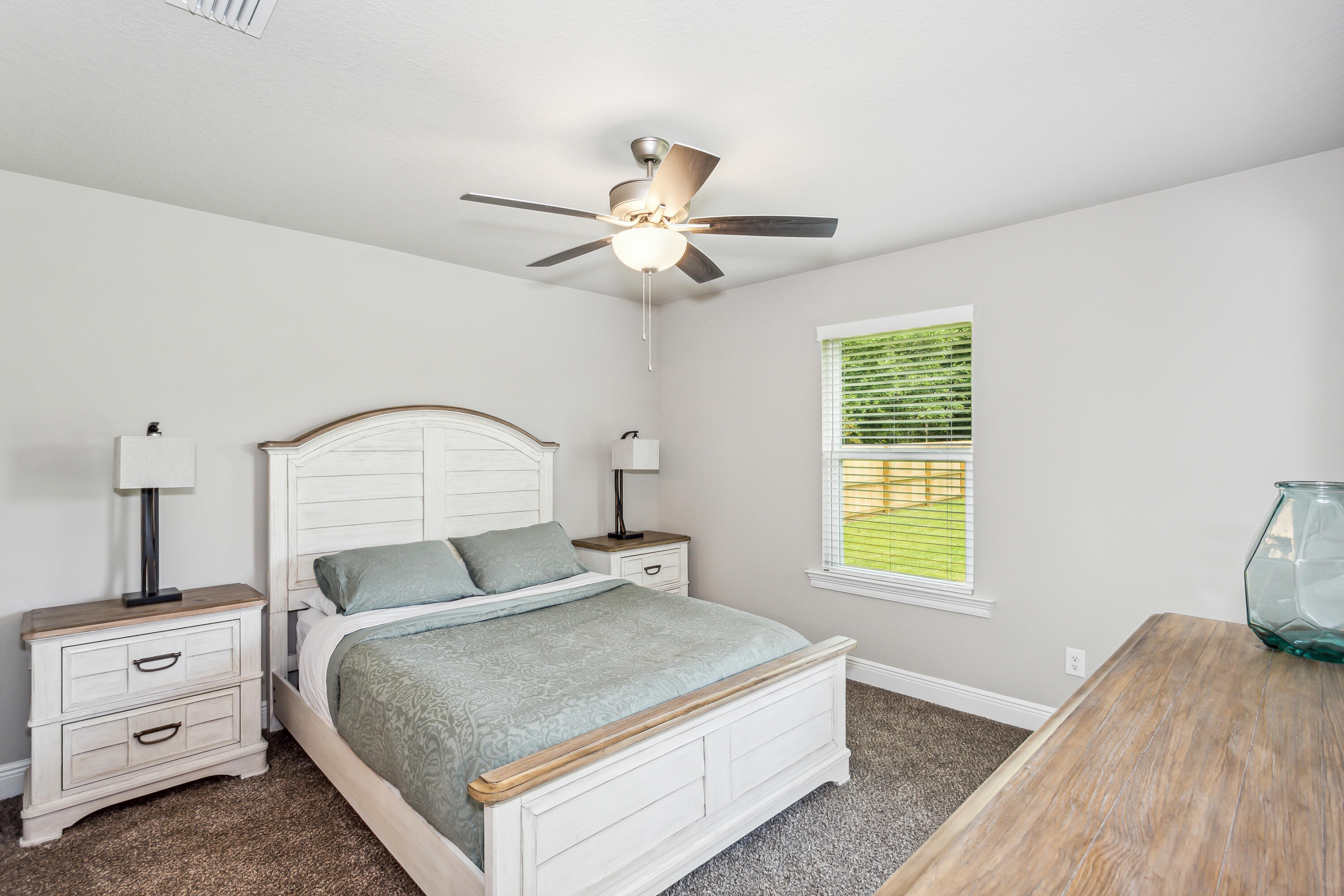 8721 Valhalla Drive Milton, FL 32583 - Photo 38 of 48 a bedroom with a bed and a window