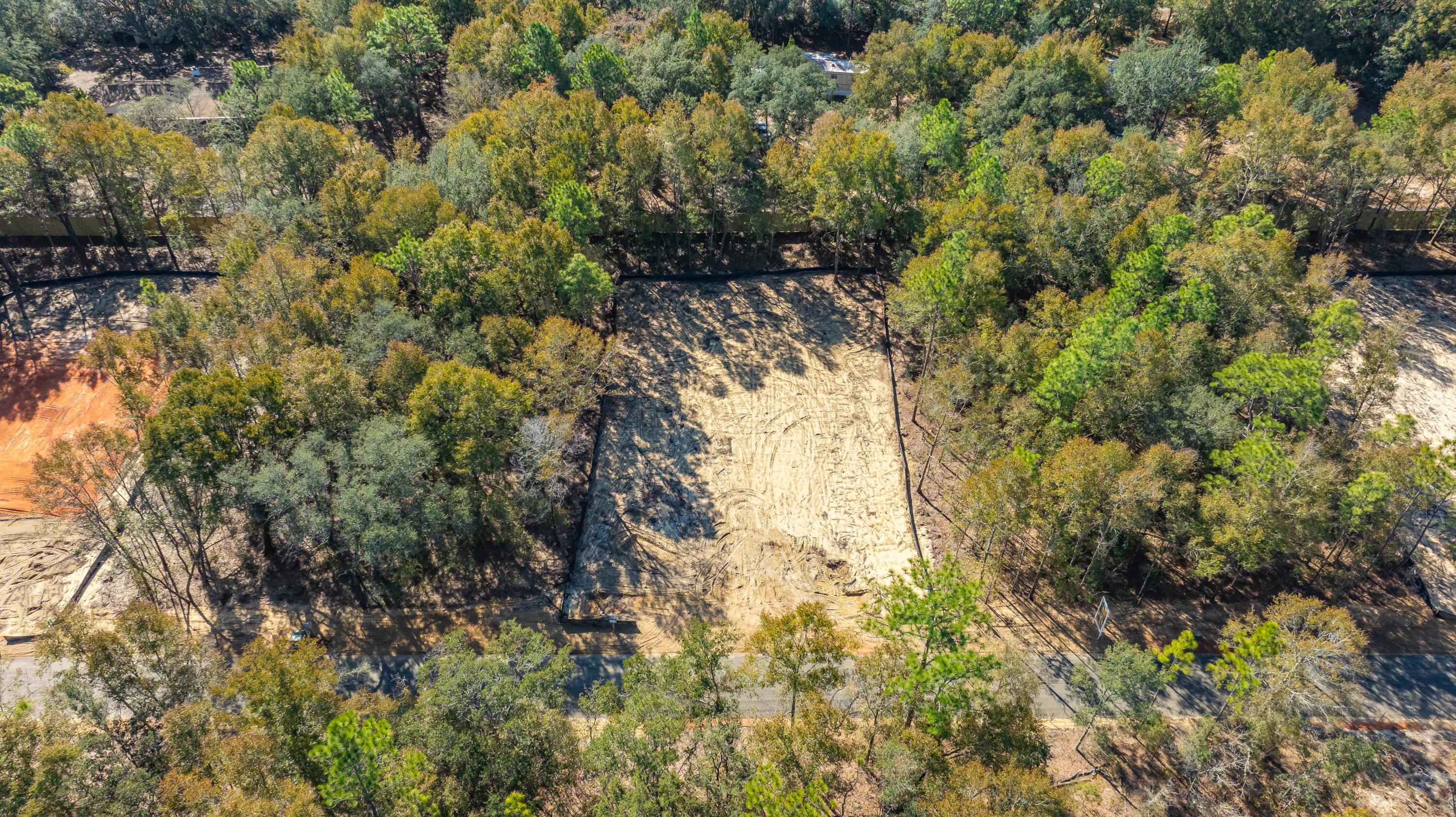 8721 Valhalla Drive Milton, FL 32583 - Photo 8 of 48 a view of a yard with plants and large trees