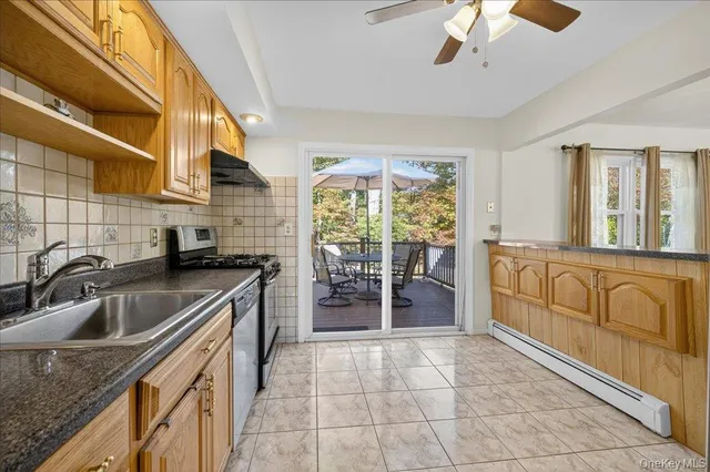 a kitchen that has a sink and a stove