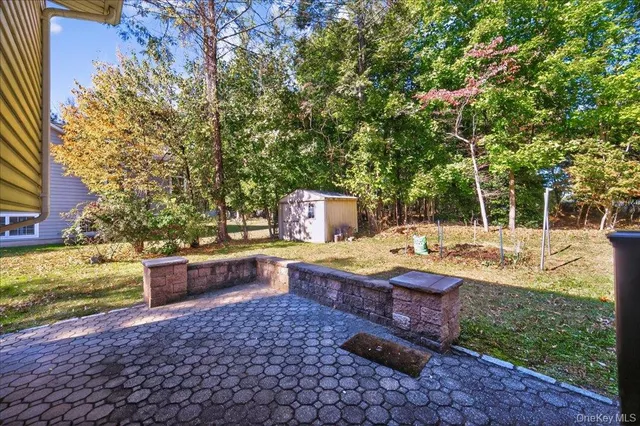 a view of a backyard with sitting area