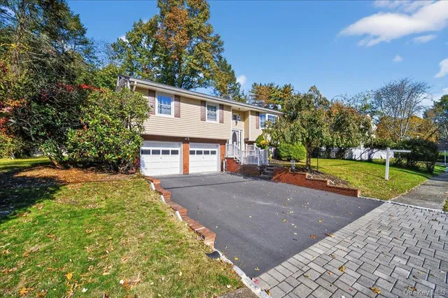 a front view of a house with yard