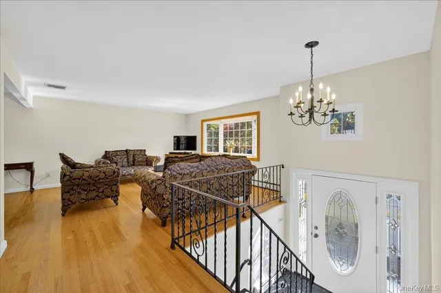 a view of a livingroom with furniture and hardwood floor