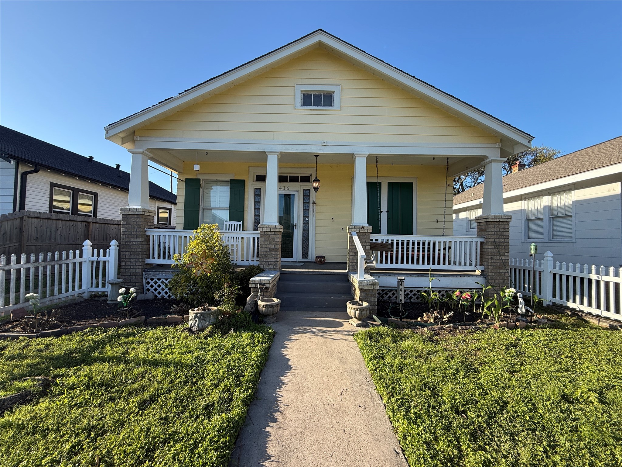 4416 Avenue R Galveston, TX 77550 - Photo 1 of 11 a front view of a house with garden