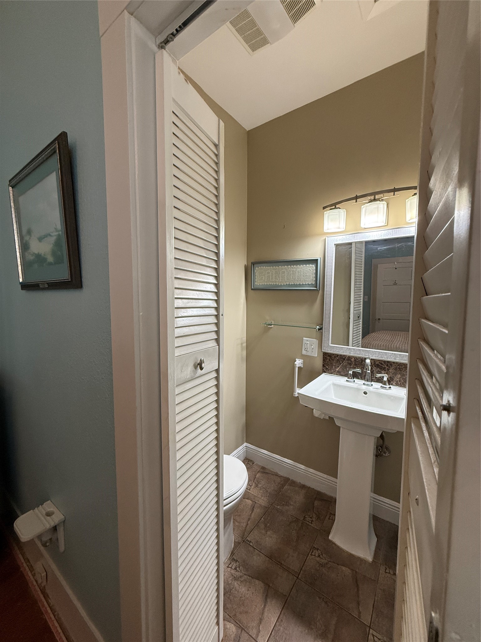 4416 Avenue R Galveston, TX 77550 - Photo 6 of 11 a bathroom with a sink a toilet and shower