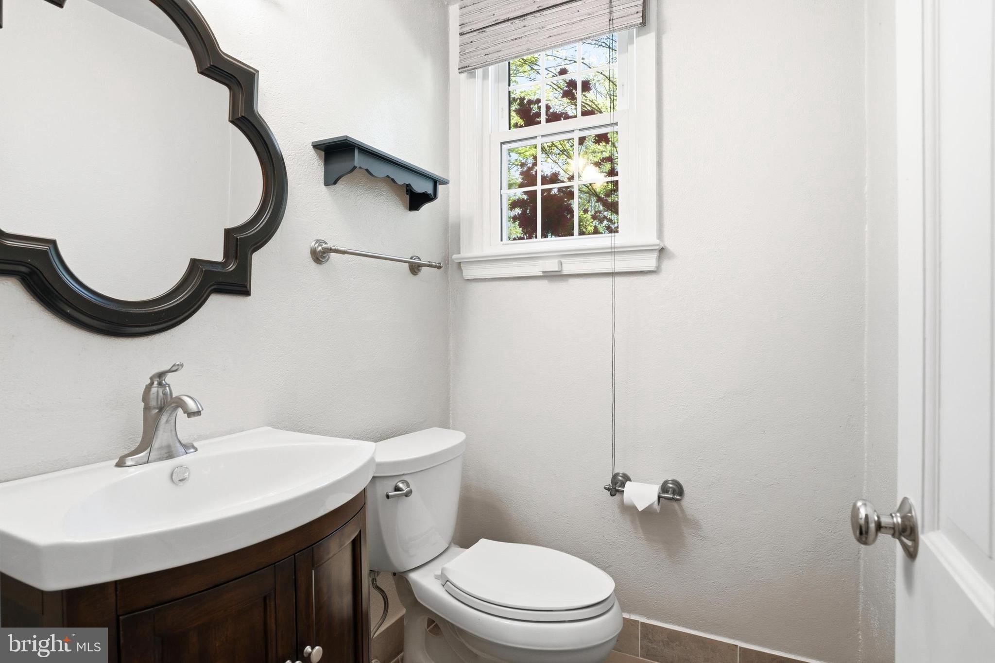 4511 Province Line Road Princeton, NJ 08540 - Photo 23 of 34 a bathroom with a sink a toilet and a mirror