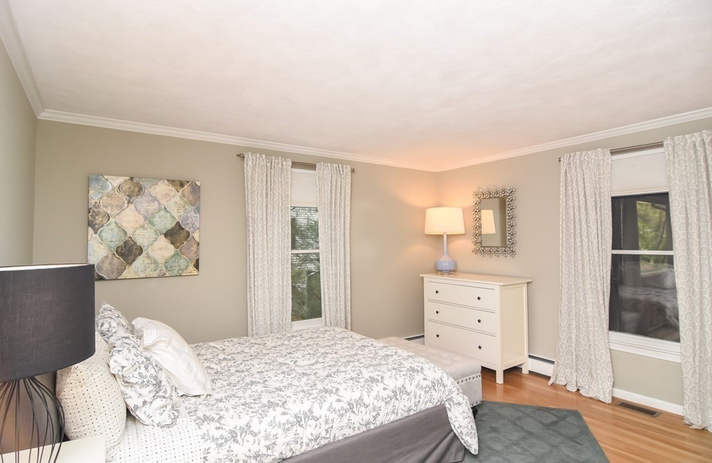 73 Cynthia Road Needham, MA 02494 - Photo 21 of 41 a bedroom with a bed and a dresser