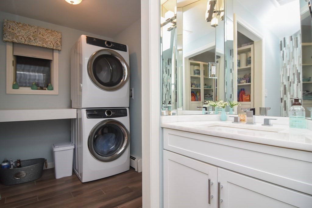 73 Cynthia Road Needham, MA 02494 - Photo 25 of 41 a utility room with sink dryer and washer