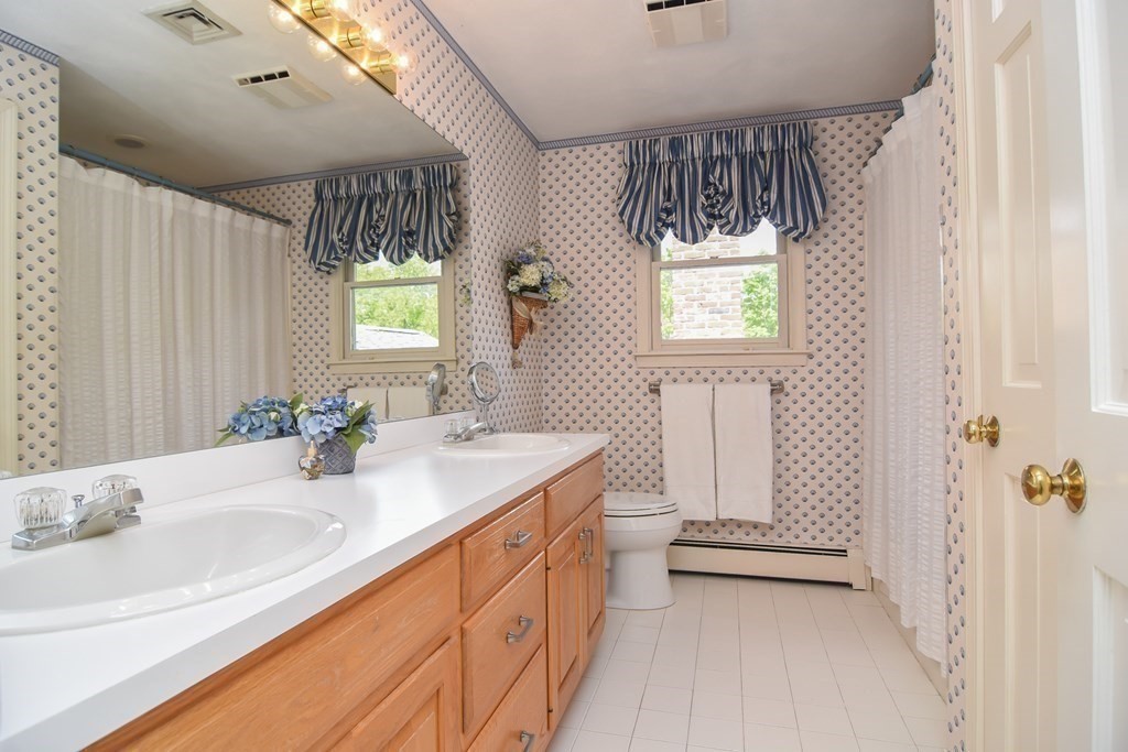 73 Cynthia Road Needham, MA 02494 - Photo 29 of 41 a bathroom with a sink a toilet and shower