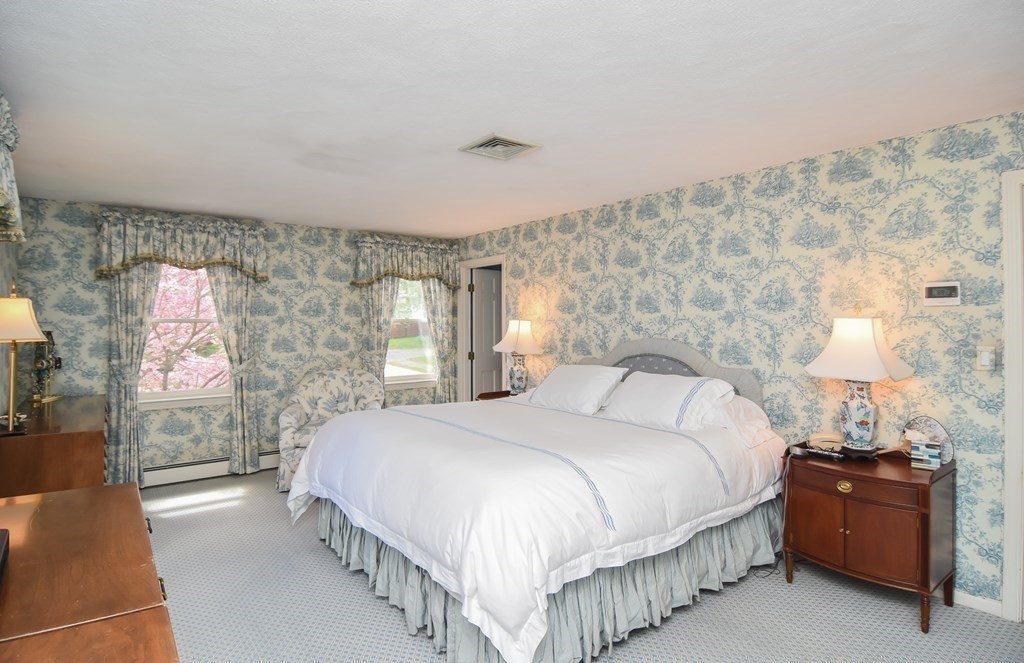 73 Cynthia Road Needham, MA 02494 - Photo 31 of 41 a bedroom with a bed and a night stand