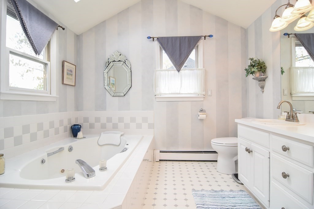 73 Cynthia Road Needham, MA 02494 - Photo 33 of 41 a bathroom with a bathtub sink and toilet