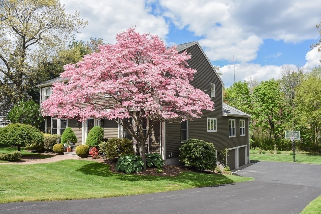73 Cynthia Road Needham, MA 02494 - Photo 36 of 41 a front view of a house with garden