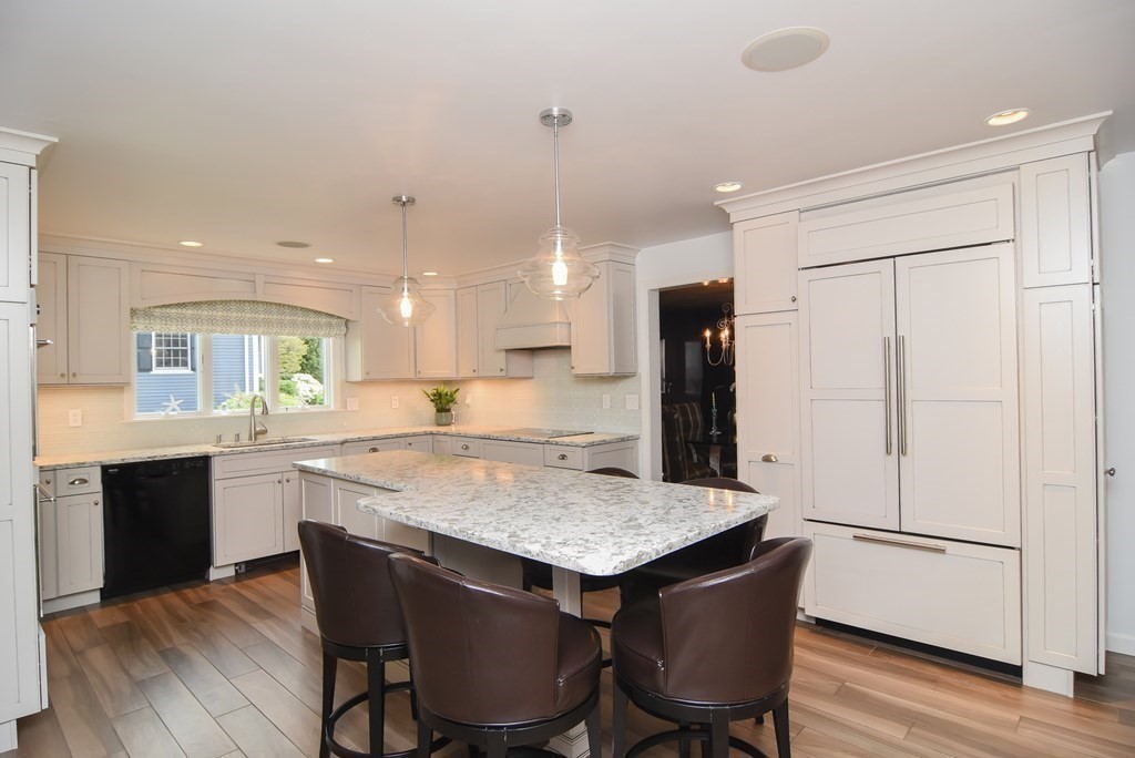 73 Cynthia Road Needham, MA 02494 - Photo 4 of 41 a kitchen with a table and chairs