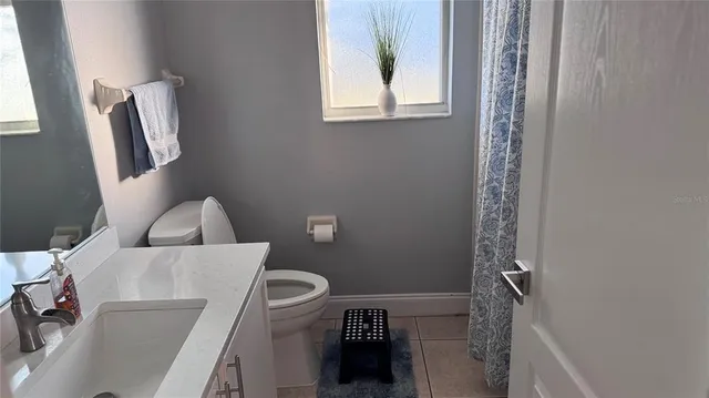 a bathroom with a toilet and a sink