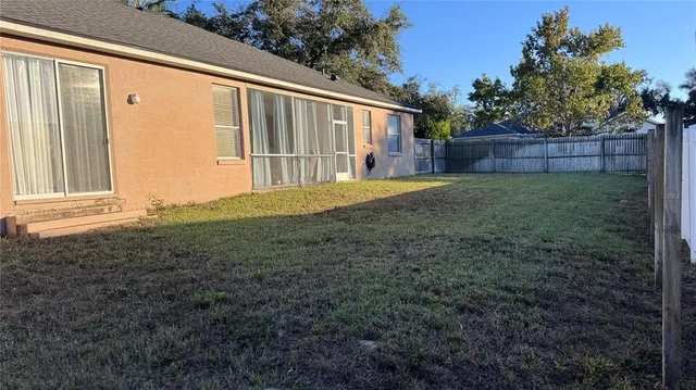 a backyard of a house with garden