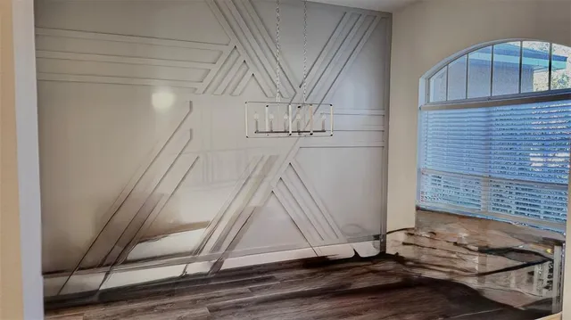 a view of an empty room and window