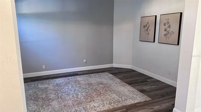 a kitchen with stainless steel appliances kitchen island granite countertop a refrigerator and microwave