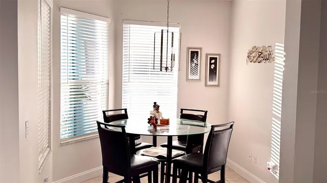 a kitchen with stainless steel appliances a sink a stove and a window